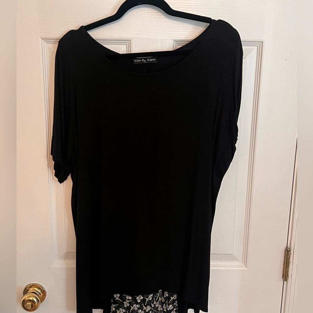 Black flowy top with cute floral pattern in back